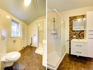 a bathroom with a shower and a toilet and a sink at Holiday Home Buitenplaats Gerner-3 by Interhome in Dalfsen