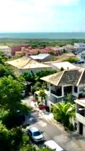 an aerial view of a city with a car parked at Villa Saint Tropez in Cabo Frio
