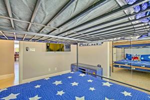 a bedroom with a bed with stars on it at Adobe Escape with Private Spa and Pool in La Quinta! in La Quinta +19 photos