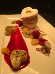 a plate of food with strawberries and other foods at Callander Meadows in Callander