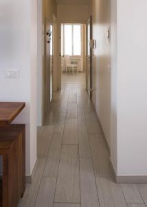 a hallway with a wooden floor in a room at Corte del Tintor Apartments in Venice