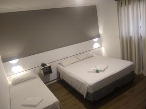 Cama o camas de una habitación en Uniclass Hotel Lapa