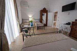 TV a/nebo společenská místnost v ubytování B&B Palazzo Loreto