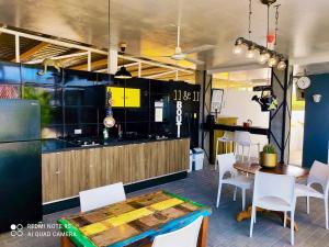 a kitchen and dining room with a table and chairs at Studios 11and11Aruba in Palm-Eagle Beach