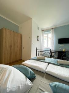 Postel nebo postele na pokoji v ubytování Rooms Lucia
