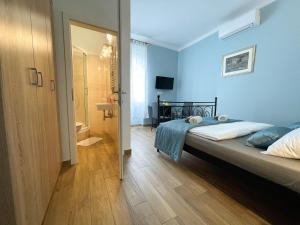 Postel nebo postele na pokoji v ubytování Rooms Lucia