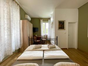 Postel nebo postele na pokoji v ubytování Rooms Lucia