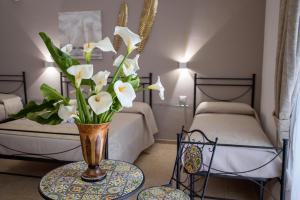 Postel nebo postele na pokoji v ubytování B&B Palazzo Loreto