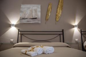 Postel nebo postele na pokoji v ubytování B&B Palazzo Loreto