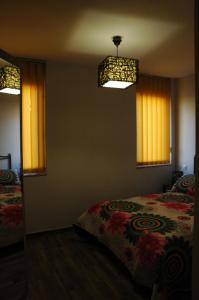 A bed or beds in a room at Canadina 2