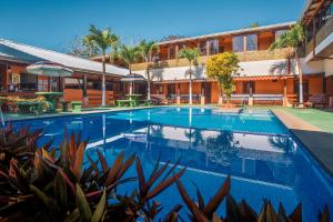 a swimming pool in front of a building at Hotel La Hacienda in Quesada