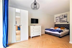 Postel nebo postele na pokoji v ubytování Apartamenty Royal Maris 7 - najlepsza lokalizacja w Ustce, blisko plaży i portu, bezpłatny parking, ścisłe centrum