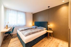 Postel nebo postele na pokoji v ubytování Marlingsuites