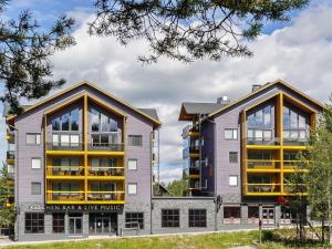 two apartment buildings next to each other at Holiday Home Levin kunkku b5 by Interhome in Levi