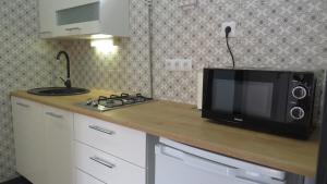 Kuchyňa alebo kuchynka v ubytovaní Repose Apartments
