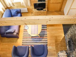 an overhead view of a living room with blue chairs at Holiday Home Miilumaja a2 by Interhome in Kotila