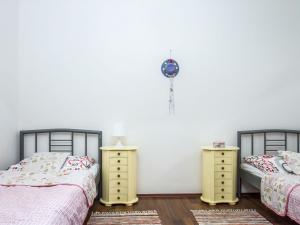 A bed or beds in a room at Apartment Twin front by Interhome
