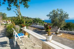 a view from the top of a hill with plants at Palaiokastro Traditional House in Mandrákion +37 photos