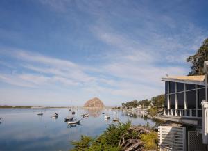 a view of a river with boats in the water at Inn at Morro Bay in Morro Bay