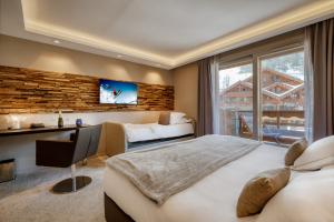 Postel nebo postele na pokoji v ubytování Hotel Le Tremplin