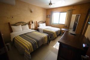 En eller flere senger på et rom på Hotel La Casona Real