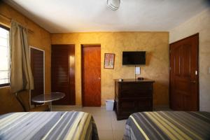 TV tai viihdekeskus majoituspaikassa Hotel La Casona Real
