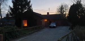 a car parked in front of a house at Guest House Rens in Bylderup-Bov