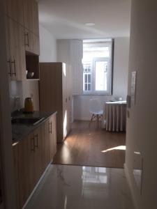 a kitchen with a table and a chair in a room at Douro - A Casinha da Ana in Vila Real +26 photos