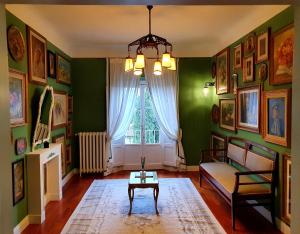 a living room with a couch and a table at Villa Nardi - Residenza D'Epoca in Florence