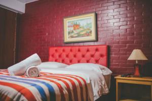 Ένα ή περισσότερα κρεβάτια σε δωμάτιο στο Hotel Excalibur