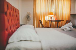 Ένα ή περισσότερα κρεβάτια σε δωμάτιο στο Hotel Excalibur