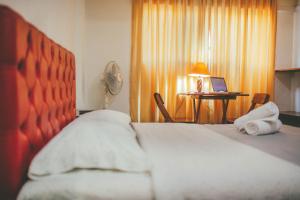 Ένα ή περισσότερα κρεβάτια σε δωμάτιο στο Hotel Excalibur