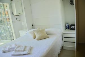 Ένα ή περισσότερα κρεβάτια σε δωμάτιο στο PALERMO Restaurantes y bares cerca de Estadio River Plate +25 φωτογραφίες