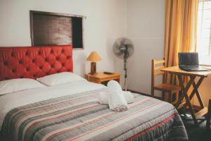 Ένα ή περισσότερα κρεβάτια σε δωμάτιο στο Hotel Excalibur