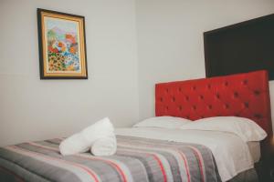 Ένα ή περισσότερα κρεβάτια σε δωμάτιο στο Hotel Excalibur