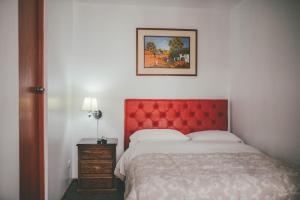 Ένα ή περισσότερα κρεβάτια σε δωμάτιο στο Hotel Excalibur