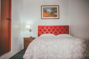 Ένα ή περισσότερα κρεβάτια σε δωμάτιο στο Hotel Excalibur