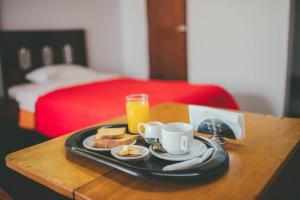 Ένα ή περισσότερα κρεβάτια σε δωμάτιο στο Hotel Excalibur