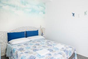 Postel nebo postele na pokoji v ubytování Acquazzurra Gaeta