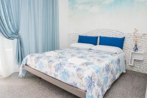 Postel nebo postele na pokoji v ubytování Acquazzurra Gaeta