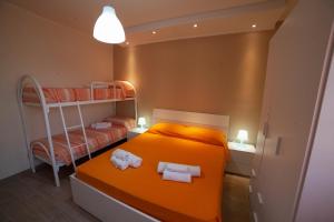 Postel nebo postele na pokoji v ubytování B&B Miramare Suite
