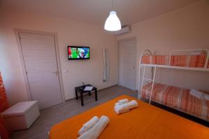 Postel nebo postele na pokoji v ubytování B&B Miramare Suite