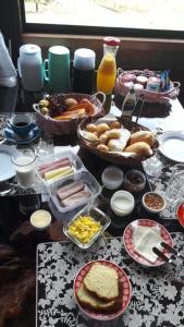 a table with a bunch of food on it at Pousada Rancho da Montanha in Visconde De Maua