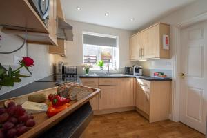 a kitchen with a tray of food on a counter at Estuary View in Whitby