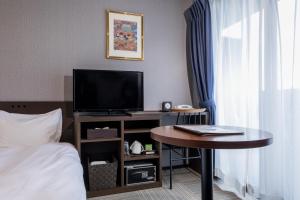 TV a/nebo společenská místnost v ubytování Tofukuji Riverside