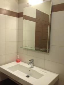 A bathroom at Angelica Studios and Apartments