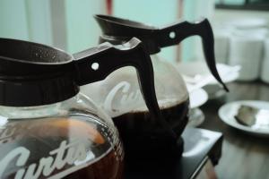 a bottle of coffee sitting on top of a table at Amaris Hotel Juanda in Jakarta