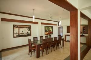 a dining room with a table and chairs at The Beach Villas by Ceylon Bungalows in Wadduwa