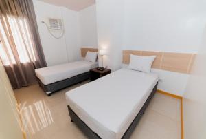 Voodi või voodid majutusasutuse Soi Suites toas