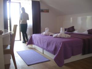 Posteľ alebo postele v izbe v ubytovaní Villa Rigo Panzió